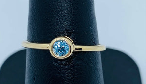 10K Yellow Gold Bezel Set Blue Topaz Ring